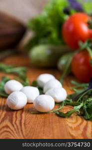 background from mixed vegetables with wooden board