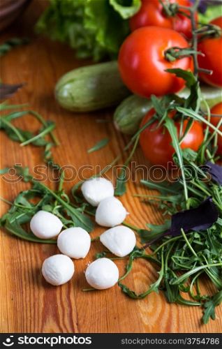 background from mixed vegetables with wooden board