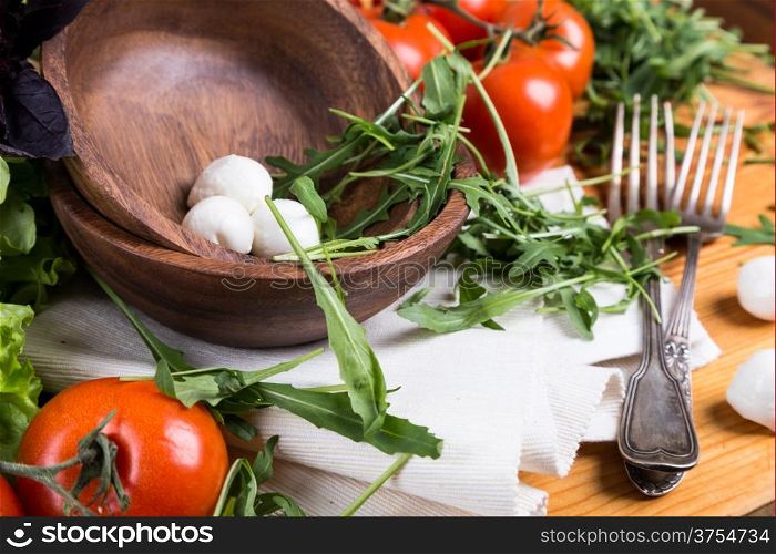background from mixed vegetables with wooden bowl