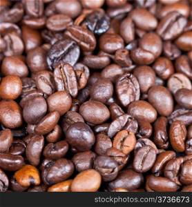 background from natural roasted coffee beans close up