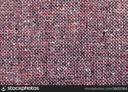 background from red black and white woolen neps fabric close up
