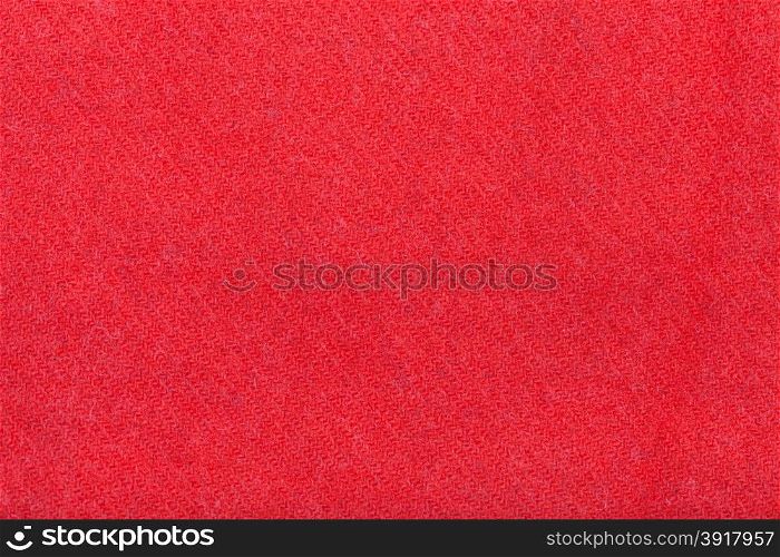 background from red woolen fabric close up