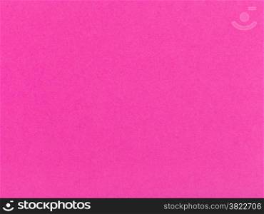 background from sheet of color dark pink paper close up