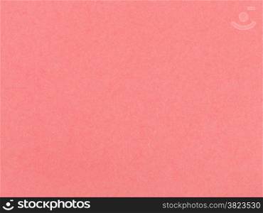 background from sheet of coral colored pastel paper close up