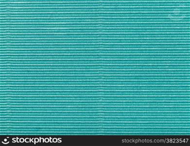 background from sheet of corrugated wrapping green color paper close up