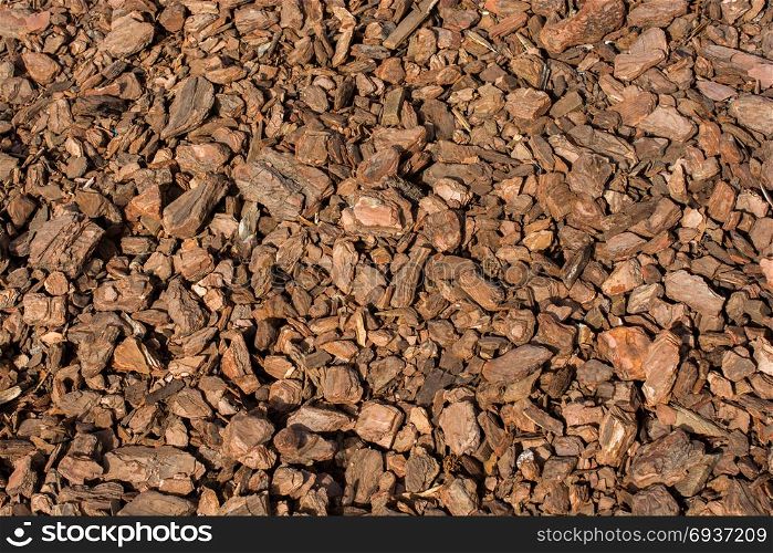 Background full of brown natural tree bark mulch