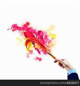 Background image. Background image with human hand holding paint brush