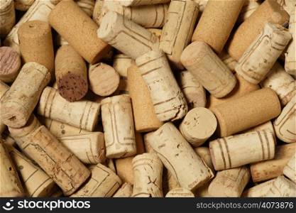 Background image of a large pile of wine bottle corks.