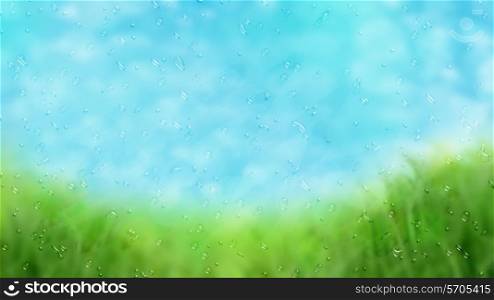 Background image of a rainy window looking out onto a grassy landscape