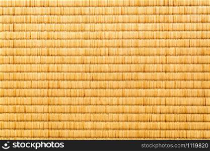 Background image of Japanese Tatami Mat. Closeup texture of japanese tatami mat in the room.