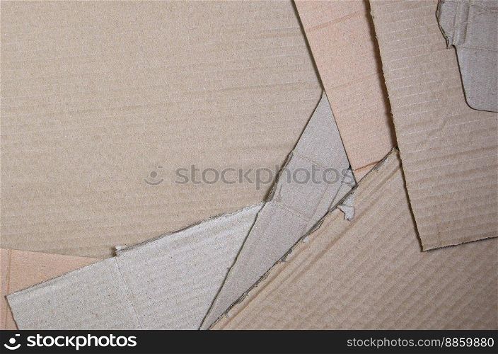 Background image with a lot of beige cardboard paper, which is used to make boxes for the transport of home appliances and postal parcels. Carton texture