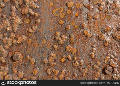 Background iron plate, corroded, rusted, blistered.
