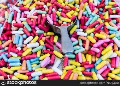 Background made of colorful sweets and candies. assortment colorful gummy candies at market