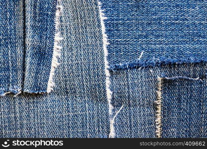 background made of old jeans rags close up