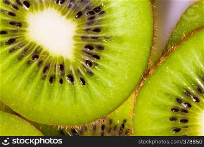 background made with a heap of sliced kiwis