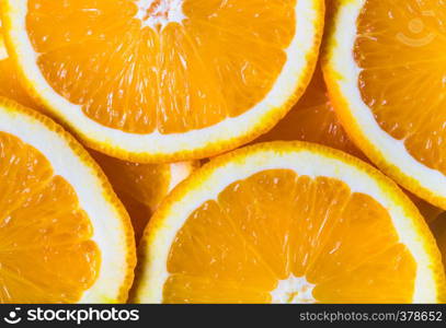 background made with a heap of sliced oranges