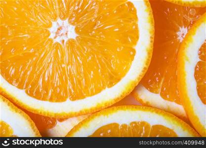 background made with a heap of sliced oranges