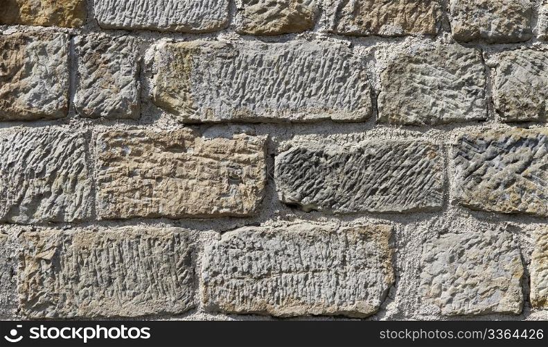 background massive stone wall. background or texture of a massive stone wall