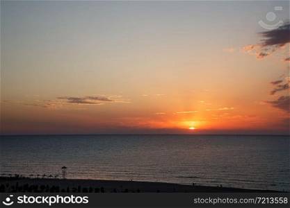 background of a beautiful orange-red sunset on the Caspian sea . selective focus