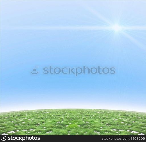 Background of a beautiful sunny day with snow between the green grass.