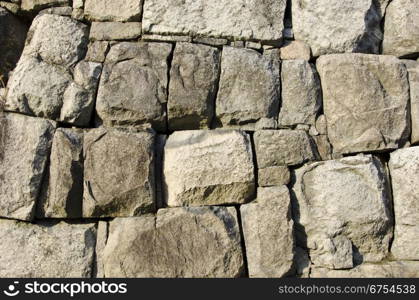 Background of a stone wall with big boulders