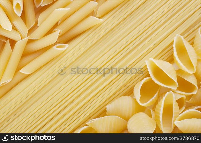 Background of a variety of tasty wheat pasta