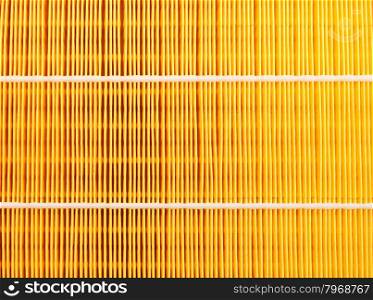 Background of a yellow car air filter closeup.