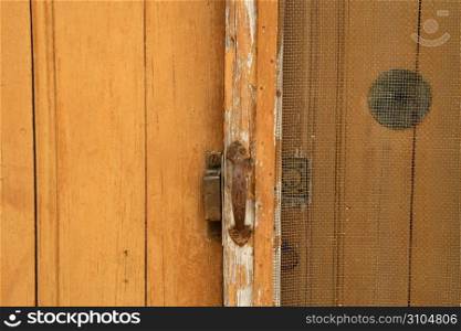 Background of aged grunge wooden door golden brown
