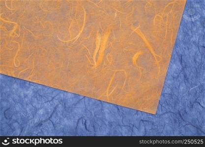 background of amber and blue textured handmade mulberry papers