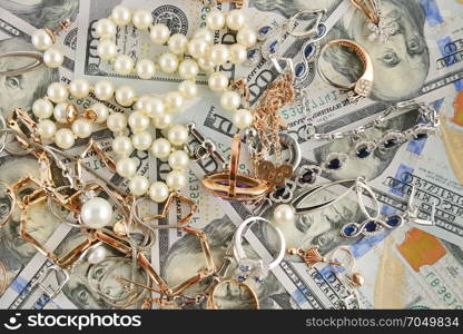 Background of American dollars and jewelry