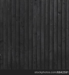 background of black stained vertical planks in square format