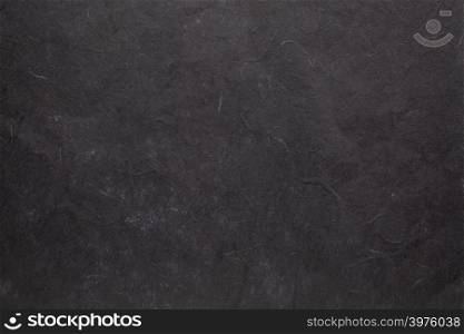 background of black textured handmade mulberry paper
