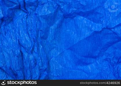 Background of blue old crumpled paper