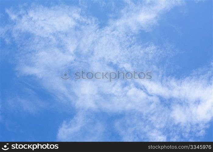 Background of blue sky and white clouds in a summer day.