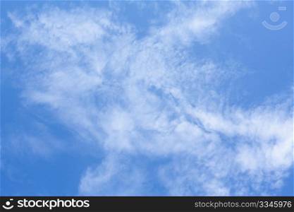 Background of blue sky and white clouds in a summer day.