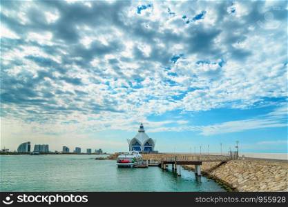 background of blue sky with beautiful clouds and azure sea with Marina in the frame. sailing on the sea yacht. the focus is selective.