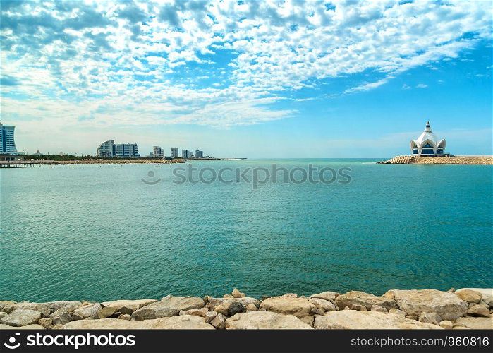 background of blue sky with beautiful clouds and azure sea with Marina in the frame. the focus is selective.