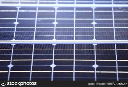 background of blue solar photovoltaic panels, charging batteries. Renewable eco energy concept