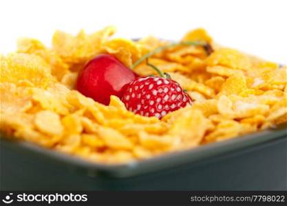 background of bowl of cornflakes milk cherry and strawberry isolated on white