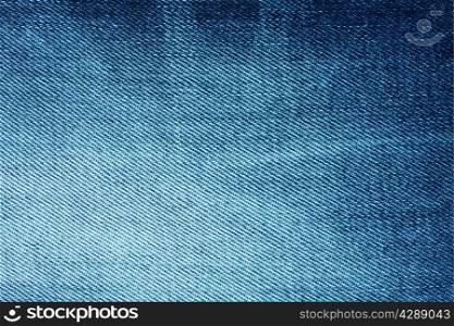 Background of bright blue denim with stripes and scuffed