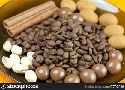 background of coffee beans, cinnamon and the sweets
