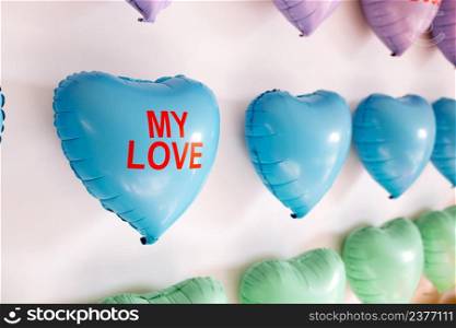 background of colorful balloons in the shape of heart. Love concept. Holiday Object, Birthday, Valentines Day, Wedding. Party decoration. Greeting card. heart with inscriptions kiss me.. background of colorful balloons in the shape of heart. Love concept. Holiday Object, Birthday, Valentines Day, Wedding. Party decoration. Greeting card. heart with inscriptions kiss me