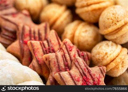 background of czech traditional homemade christmas cookies, shallow DOF, focus on foreground. czech traditional homemade christmas cookies