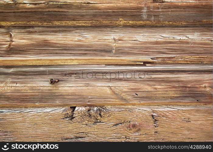Background of dark coarse treated boards with knots
