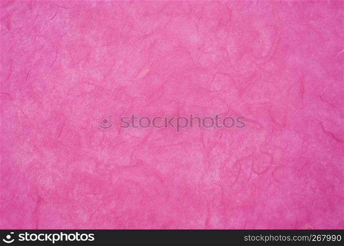 background of dark pink, textured, handmade mulberry paper