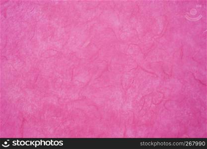 background of dark pink, textured, handmade mulberry paper