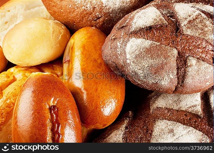 Background of different kinds bread stacked pile