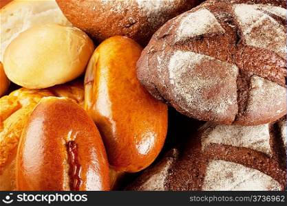 Background of different kinds bread stacked pile