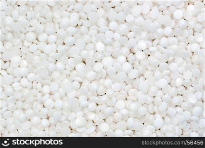 background of fine white polymer granules. fine white polymer granules