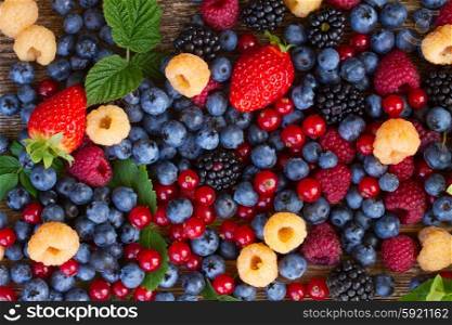 background of fresh colorful berries mix, top view